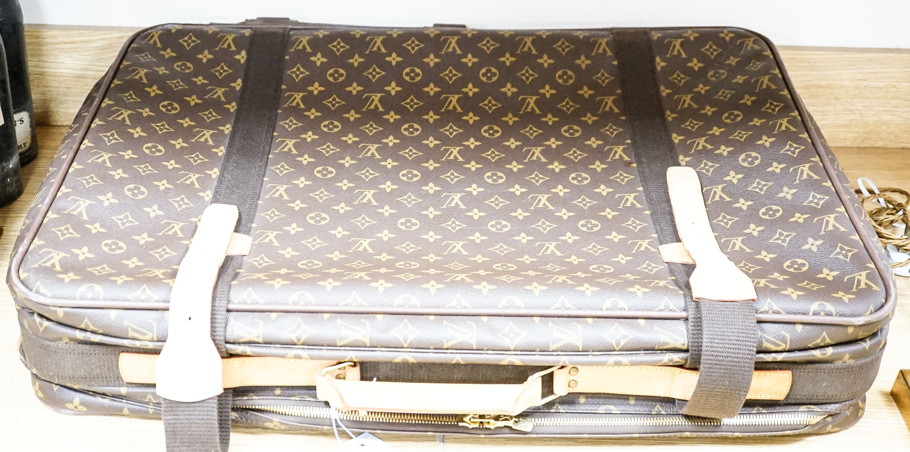 A Louis Vuitton monogram Satellite 70 suitcase initialled ‘E.F.B’ 70x50cm